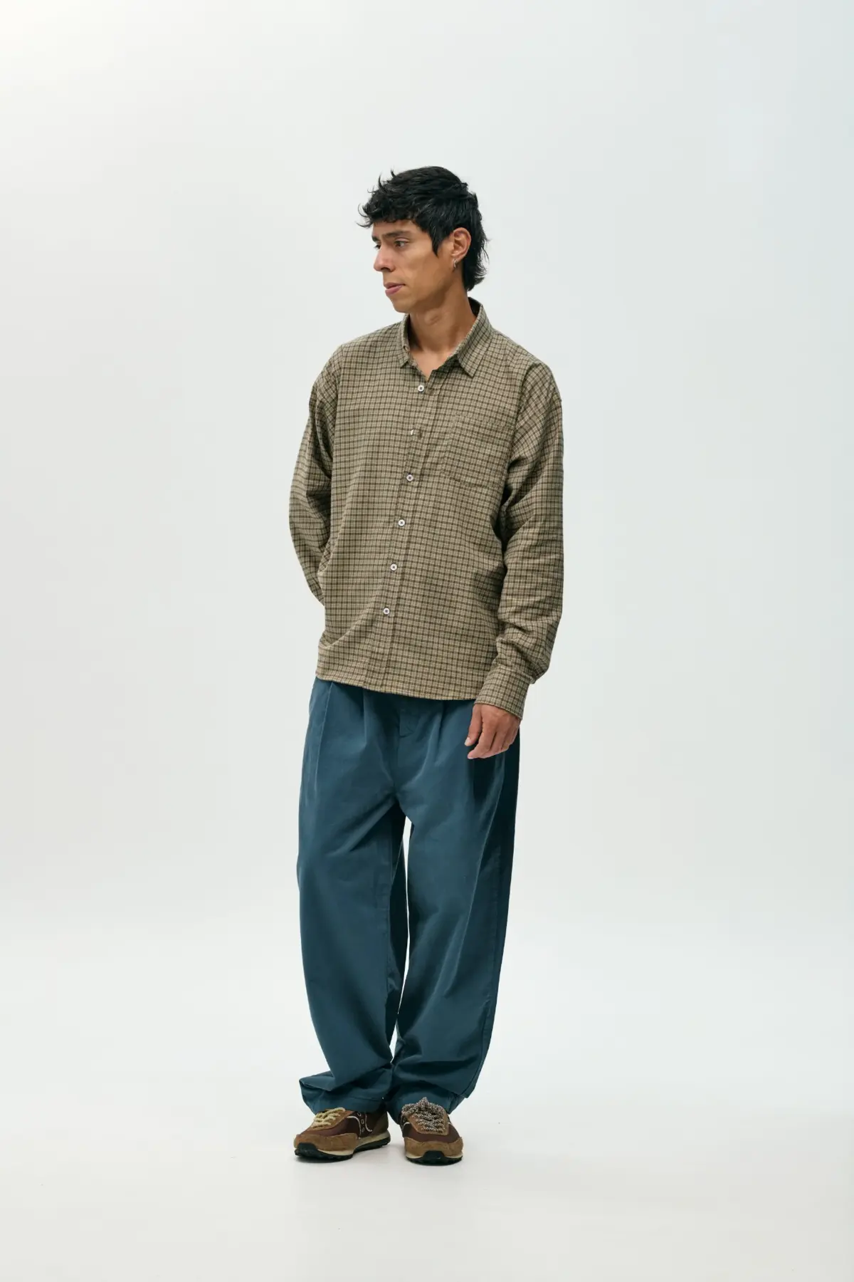 Model wearing the NWHR amber and black Grid Shirt