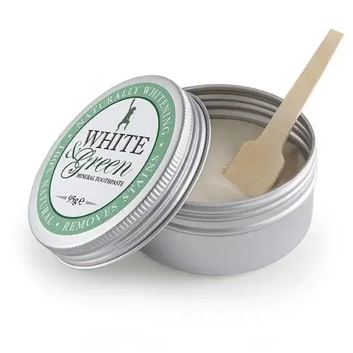 Open tin of The Green Woman White and Green mineral toothpaste